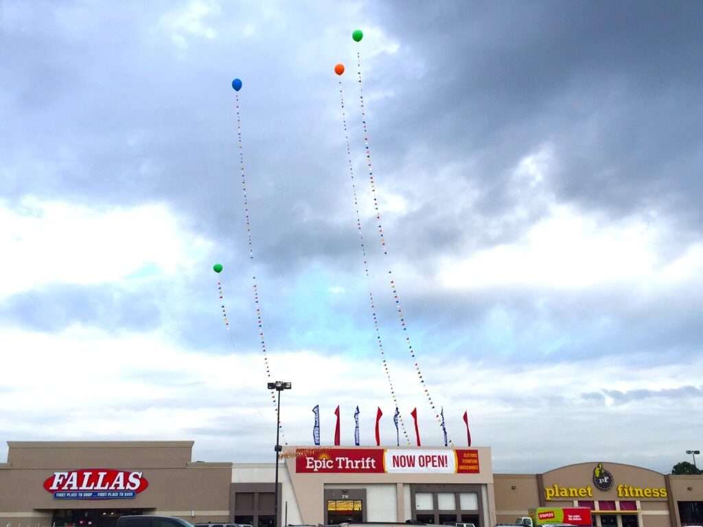Balloons above store opening announcement